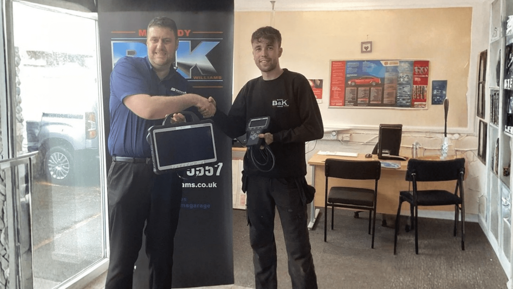 Huw Elis Williams and Matt with OEM diagnostic equipment